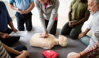 Group of diverse people in cpr training class